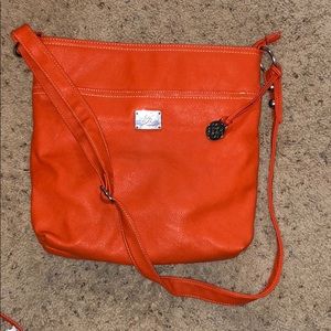 Women’s orange cross body purse